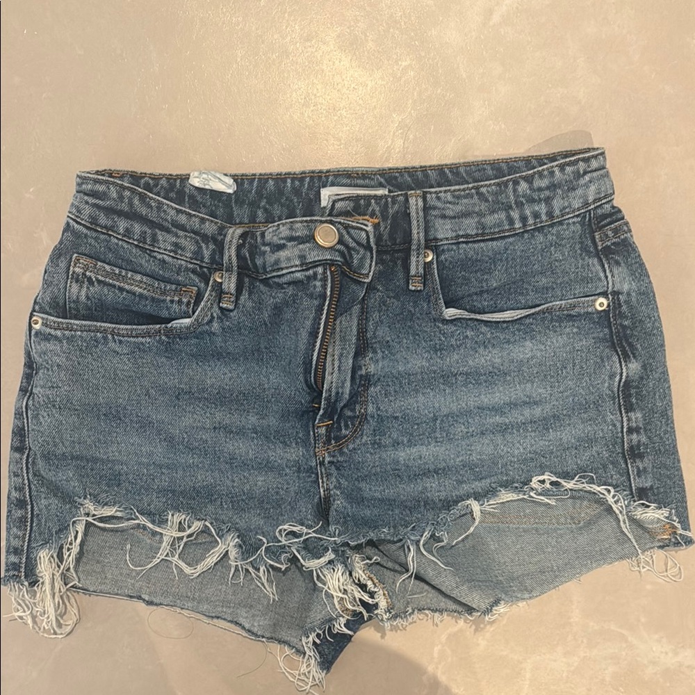 Good American Blue Jean Shorts with Distressed Hem and Cut-Off Style